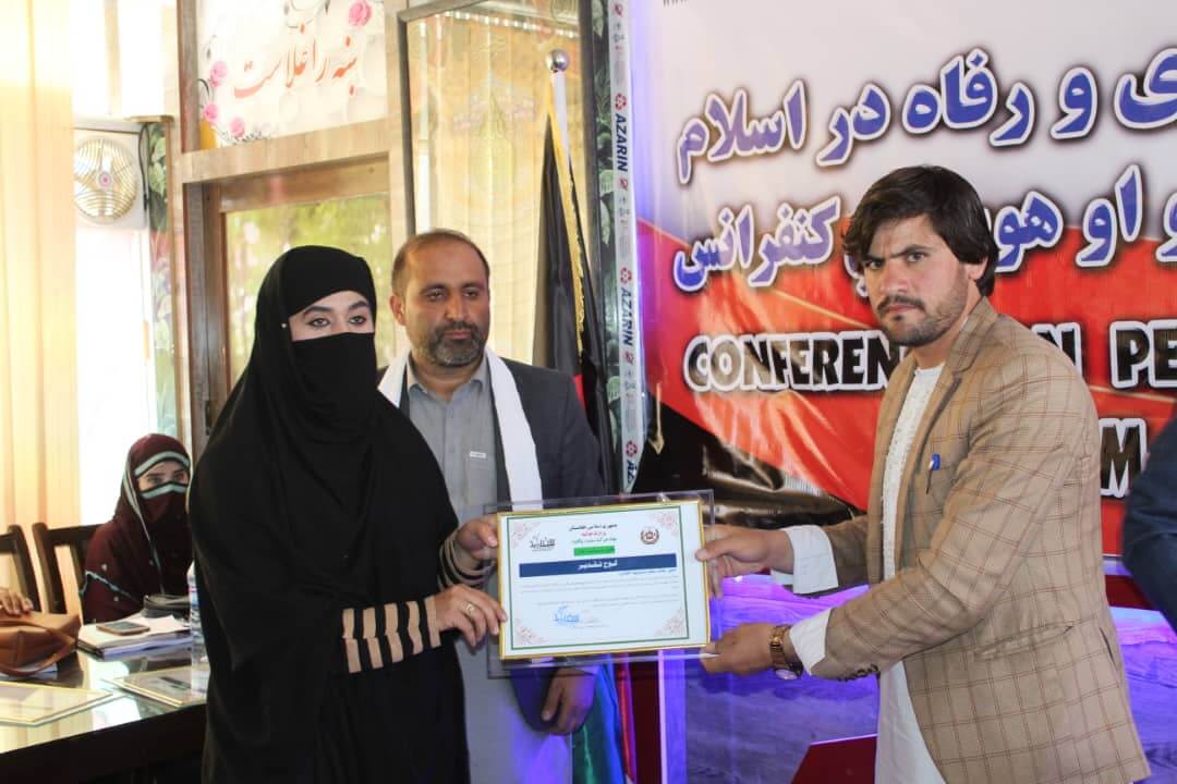 A women rights activist while receiving her appreciation letter