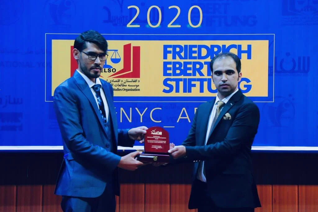 Mr. Mohammad Khalid Ramizy during awarding the appreciation plaque to Mr. Abdul Qahar Beheshti