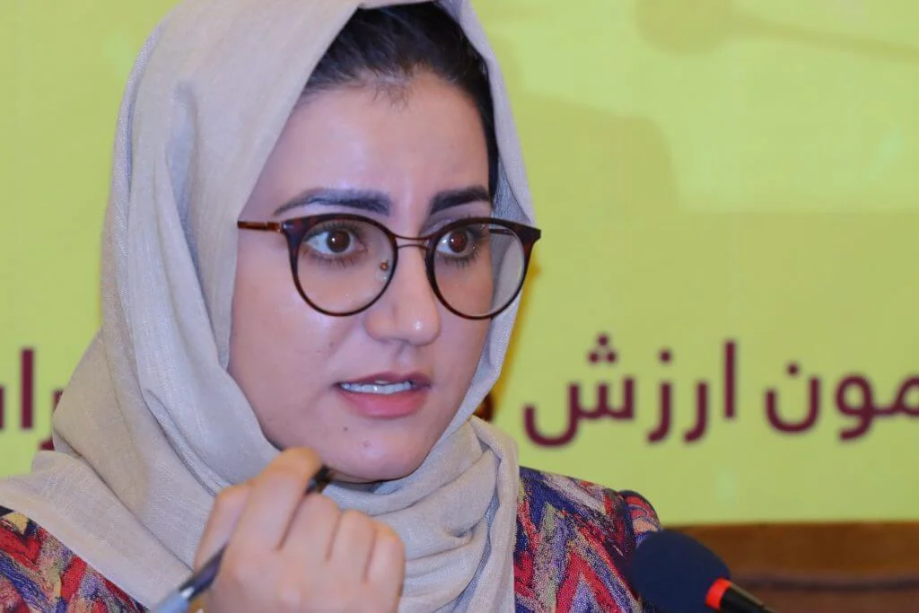 Dr. Atefa Tayeb presenting her speech to the participants of the symposium
