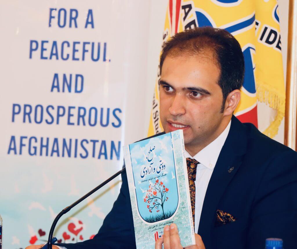 Mr. Khalid Ramizy, Executive Director of AELSO introducing the book "Peace, Love and Liberty" to the participants