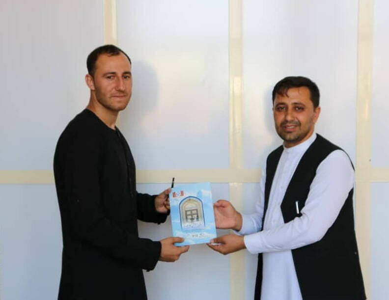 Participants while receiving free copies of the book "Islamic foundations of free society.