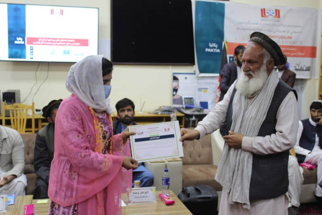 One of the participants while receiving her participation certificate...