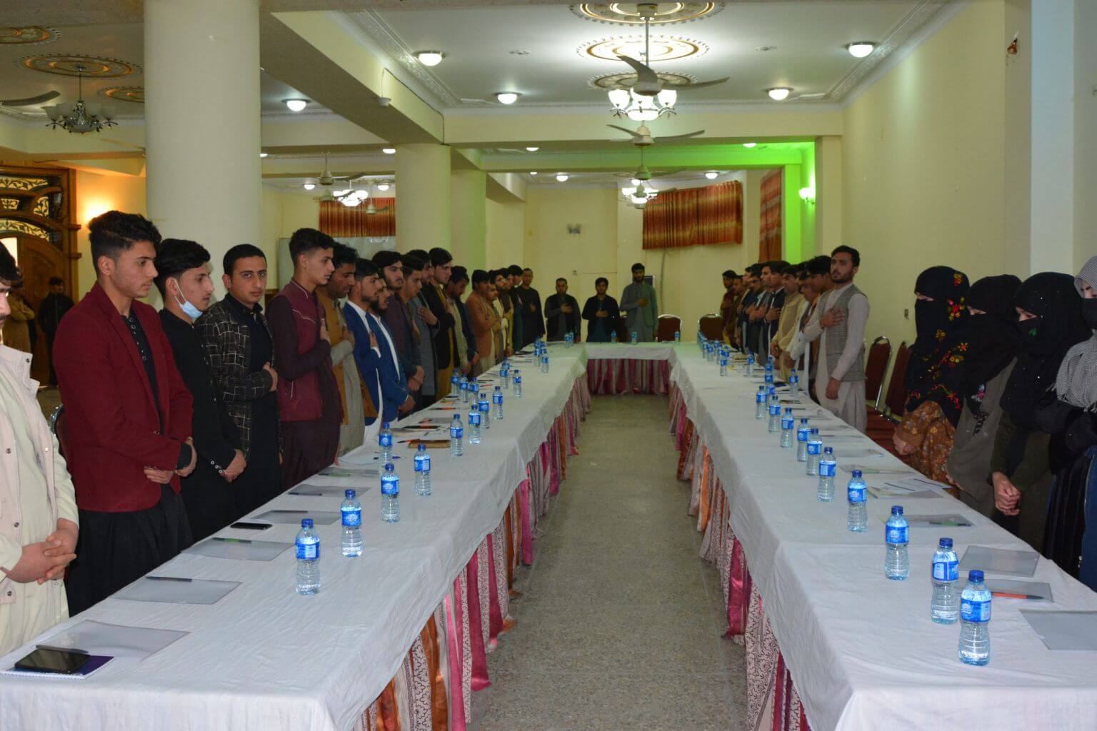 Participants of the Symposium while standing in honor of National Anthem of Afghanistan...